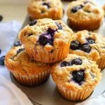 Cottage Cheese Blueberry Muffins: A Deliciously Healthy Treat 11 Cottage Cheese Blueberry Muffins stacked on a wooden table