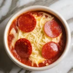 Cottage Cheese Pizza Bowls: A Cheesy Comfort Classic With a Protein Twist 11 Cottage Cheese Pizza Bowl baked in ramekin with melted cheese and pepperoni