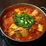 Kimchi Stew: Spicy, Soul-Warming Korean Comfort in a Bowl 11 Kimchi stew served in a traditional Korean bowl