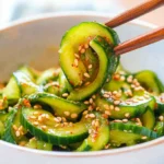 Korean Cucumber Salad That Packs Crunch and Spice 7 Korean cucumber salad with chili oil in ceramic bowl