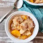 Peach Cobbler Recipe That Tastes Like Summer 7 peach cobbler recipe in cast iron skillet with golden topping