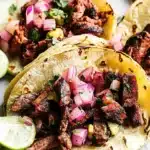 Tacos Al Pastor: A Juicy, Flavor-Packed Classic Worth Mastering 9 tacos al pastor served at sunset taco stand