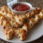 Cheesy Halloween Breadstick Bones - 22-Minute Spooky Delight 9 Cheesy Halloween Breadstick Bones with Marinara Blood for Dipping